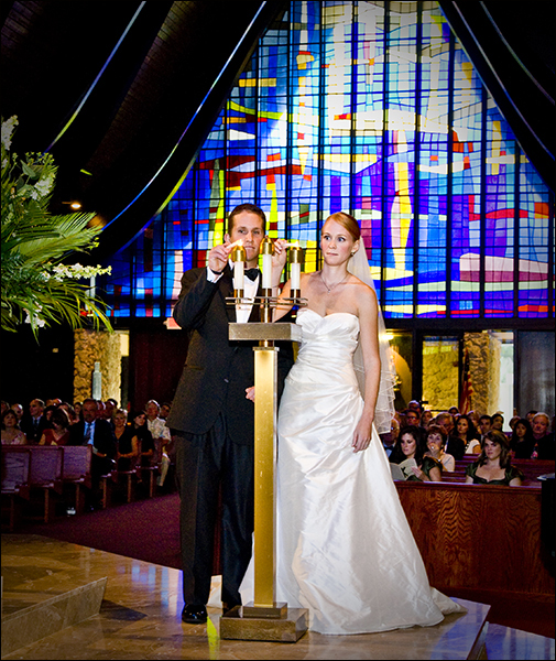 Lighting candles in church Miami